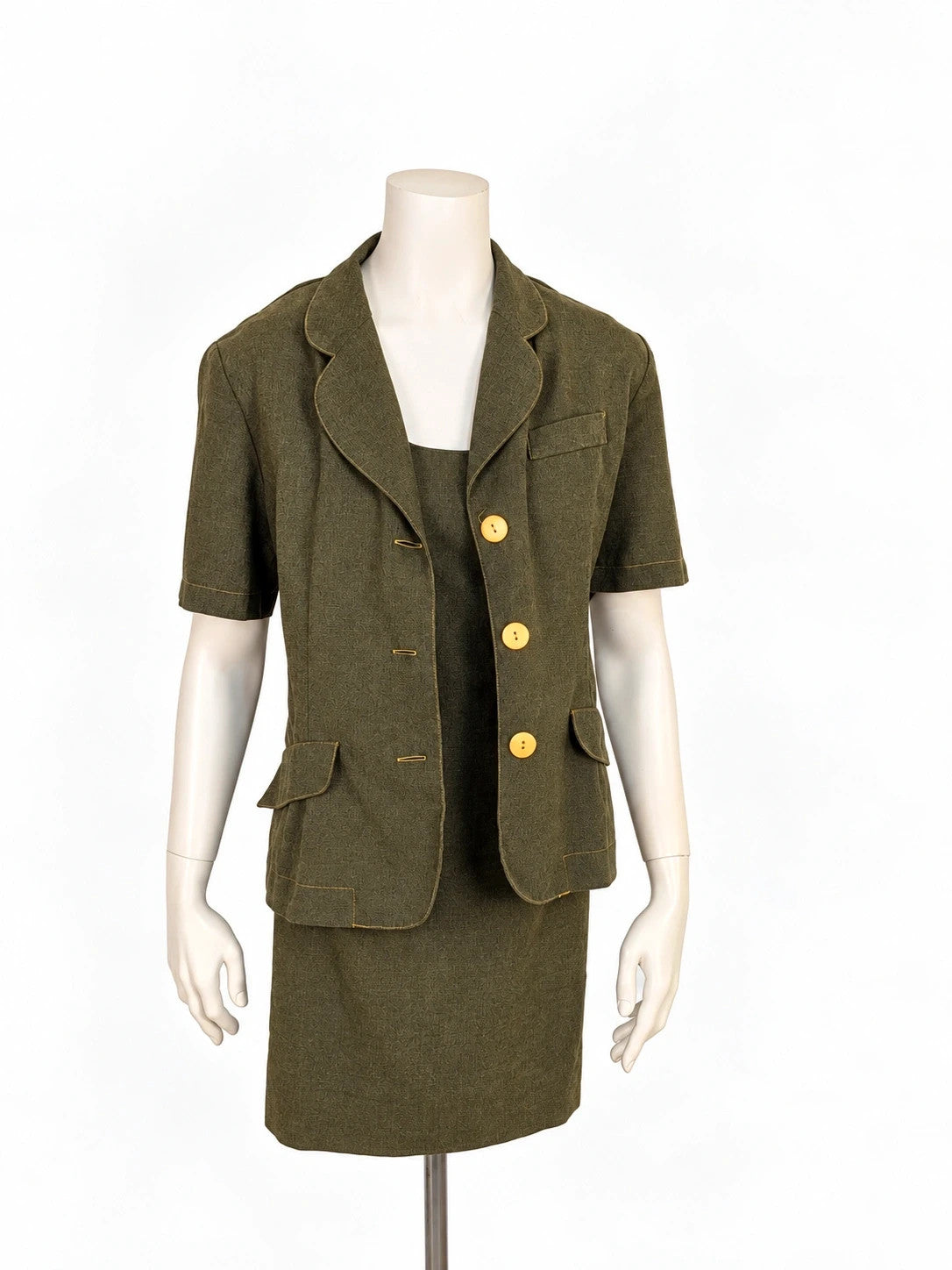 Oliva khaki skirt suit Freeling with textured fabric, short sleeve jacket, and sleeveless dress.