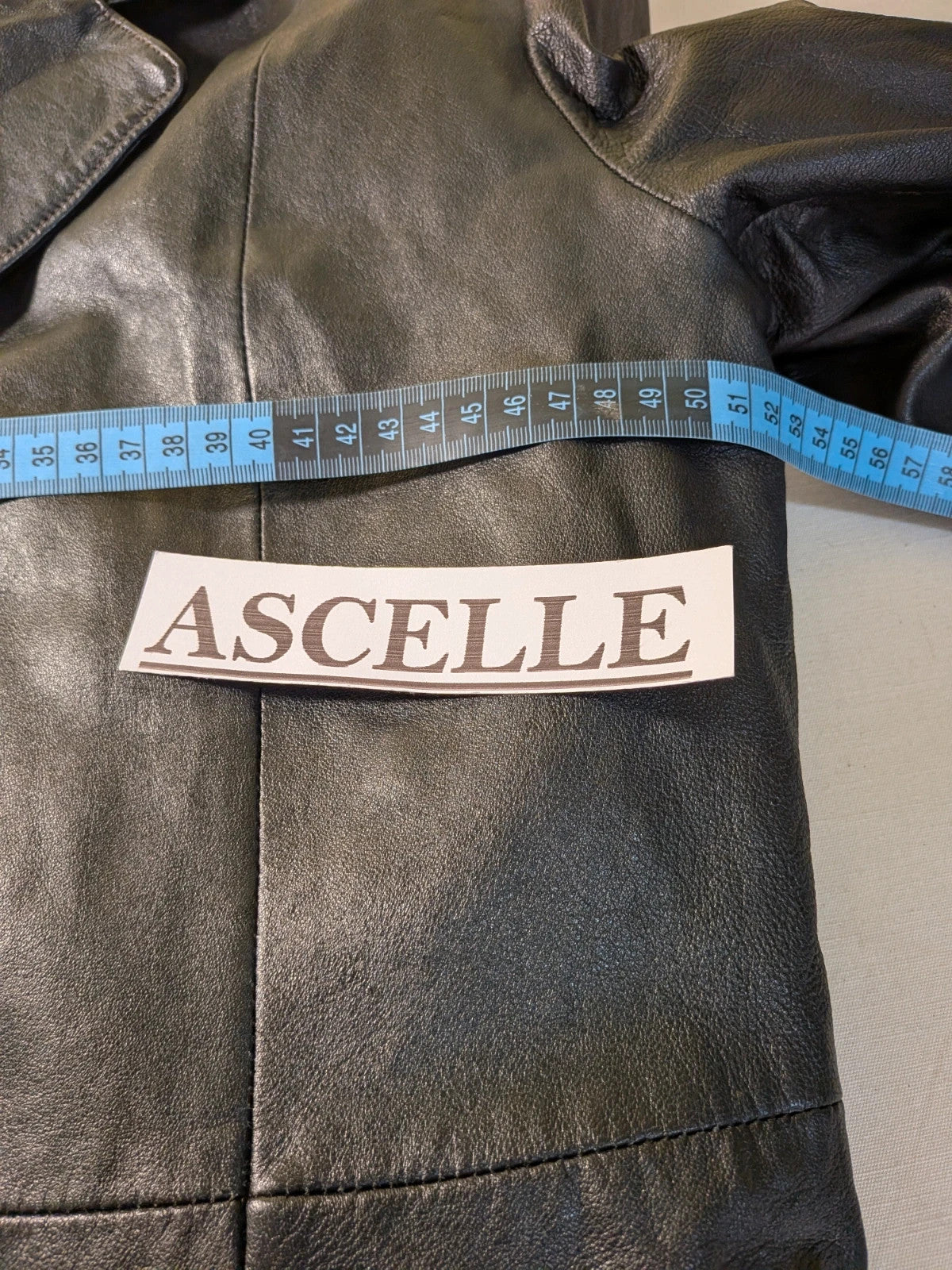 Vera Pelle black vintage leather jacket with three-button closure and Wild Cats logo.