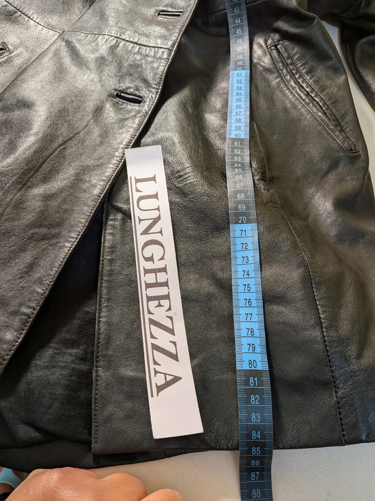 Vera Pelle black vintage leather jacket with three-button closure and Wild Cats logo.
