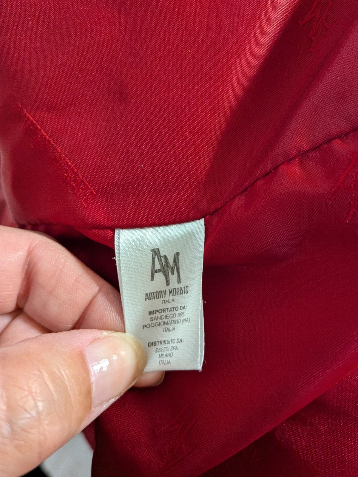 Antony Morato red puffer coat with black and white horizontal stripe, detachable sleeves.