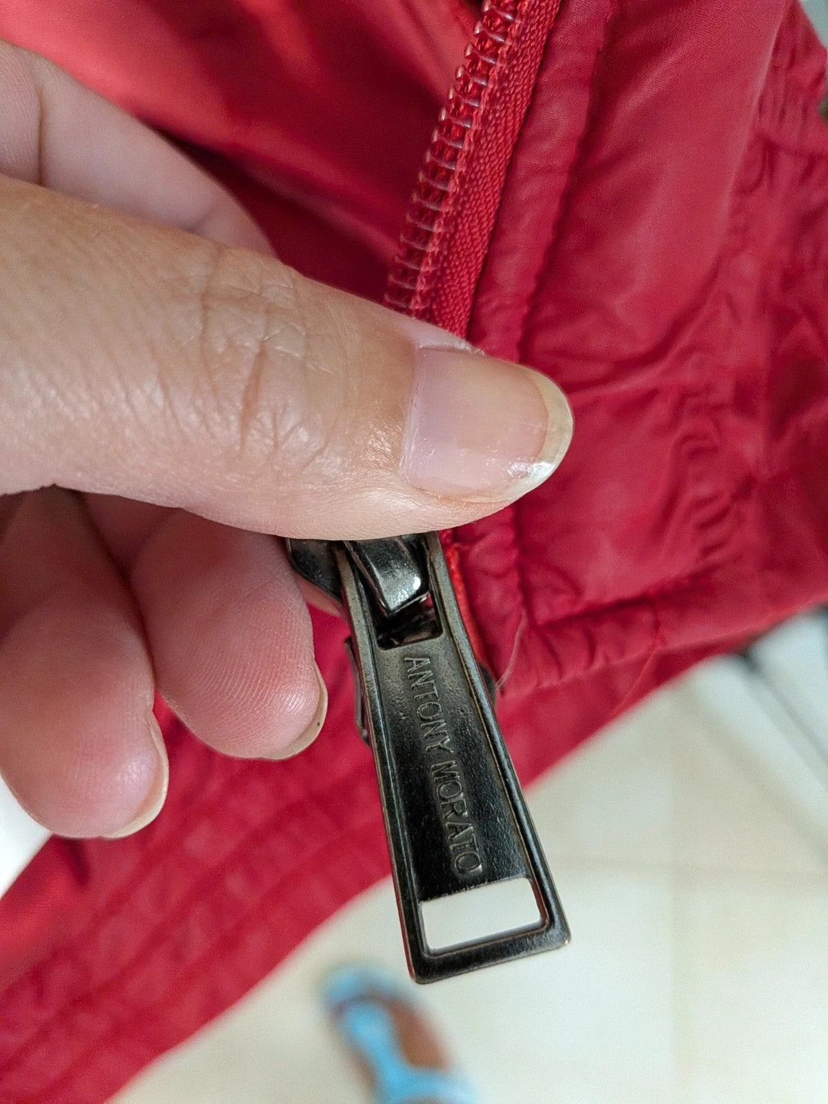 Antony Morato red puffer coat with black and white horizontal stripe, detachable sleeves.