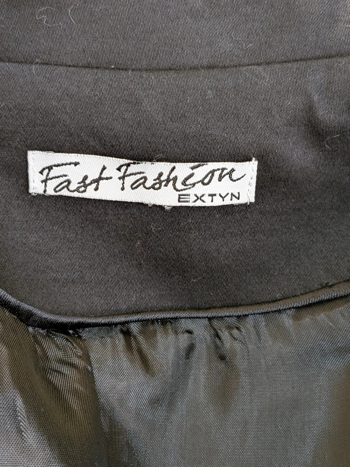 Fast Fashion Extyn black blazer with balloon sleeves and two-button closure, made in Italy.