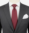 Bordeaux navy necktie 100% silk with cream polka dot pattern and original label.