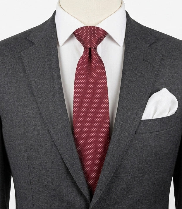 Bordeaux navy necktie 100% silk with cream polka dot pattern and original label.