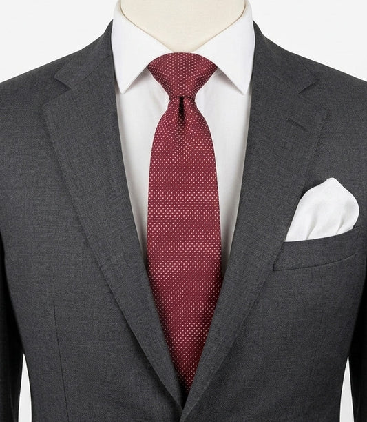 Bordeaux navy necktie 100% silk with cream polka dot pattern and original label.