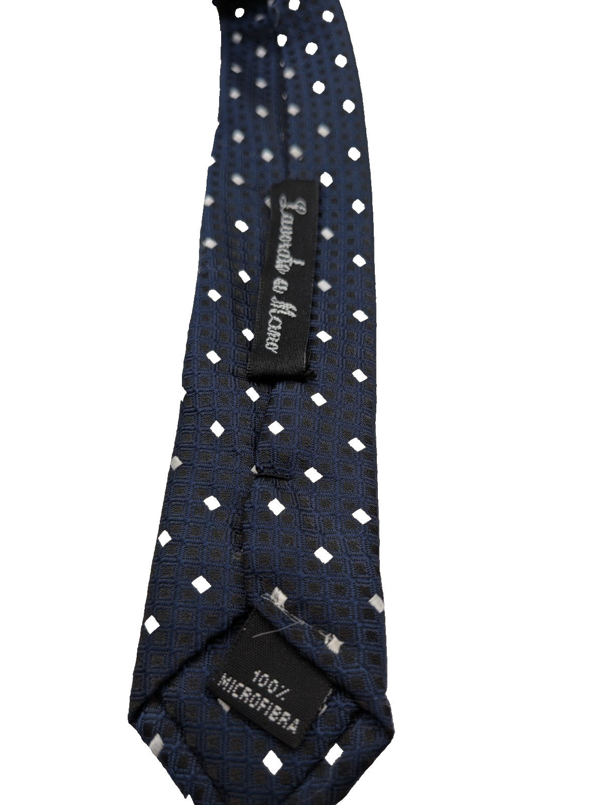 Uomo navy necktie with jacquard polka dot pattern and classic pointed style.