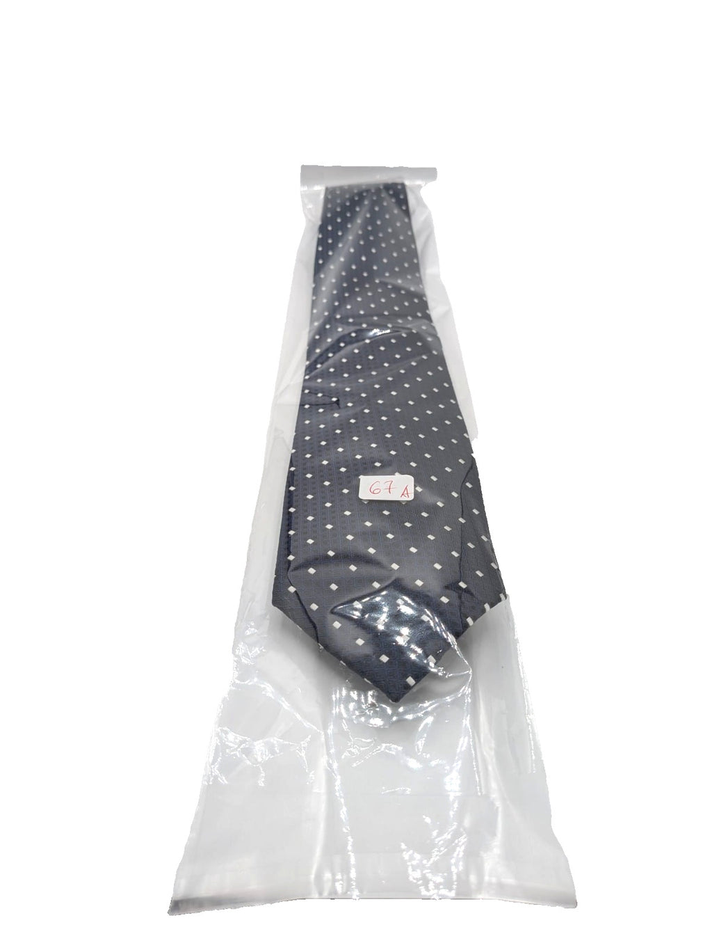 Uomo navy necktie with jacquard polka dot pattern and classic pointed style.
