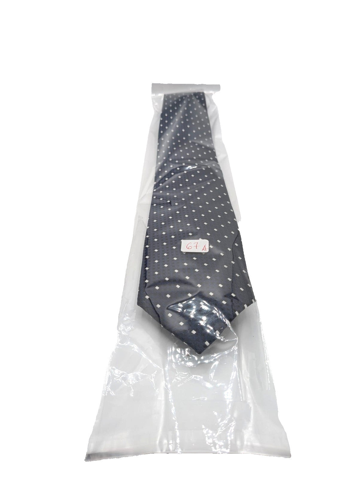 Uomo navy necktie with jacquard polka dot pattern and classic pointed style.