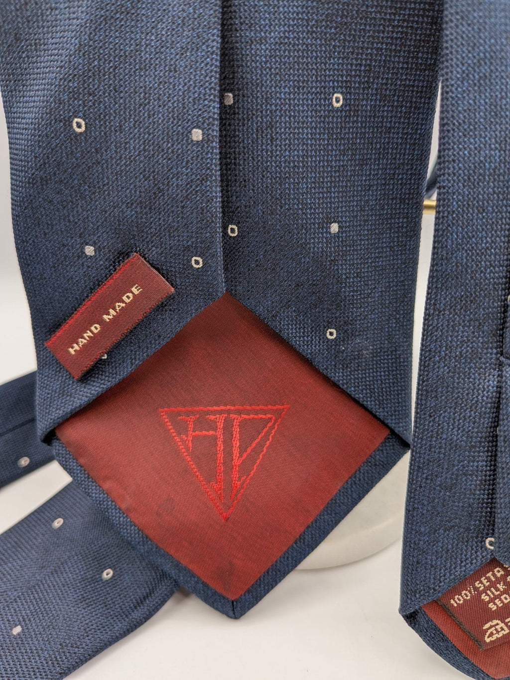 Hugo Parsons navy tie with geometric beige polka dot pattern, handmade in Italy.