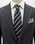 Blazer beige necktie with navy diagonal stripes and classic regimental pattern.