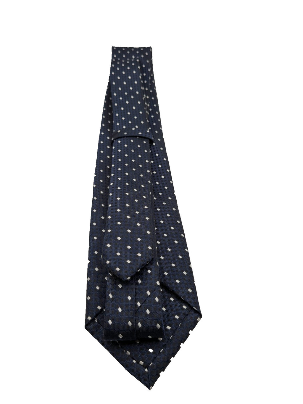 Uomo navy necktie with jacquard polka dot pattern and classic pointed style.