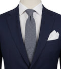 Uomo blue necktie made in Italy, textured wool fabric with elegant grey mélange pattern.