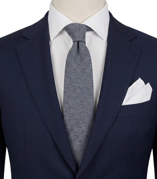 Uomo blue necktie made in Italy, textured wool fabric with elegant grey mélange pattern.