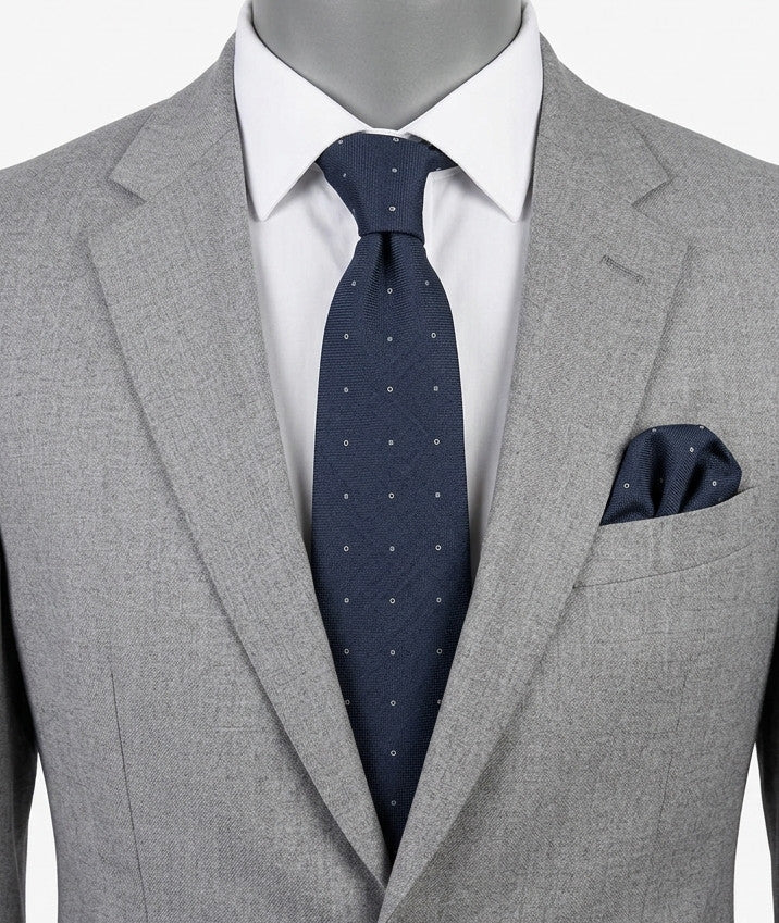 Hugo Parsons navy tie with geometric beige polka dot pattern, handmade in Italy.