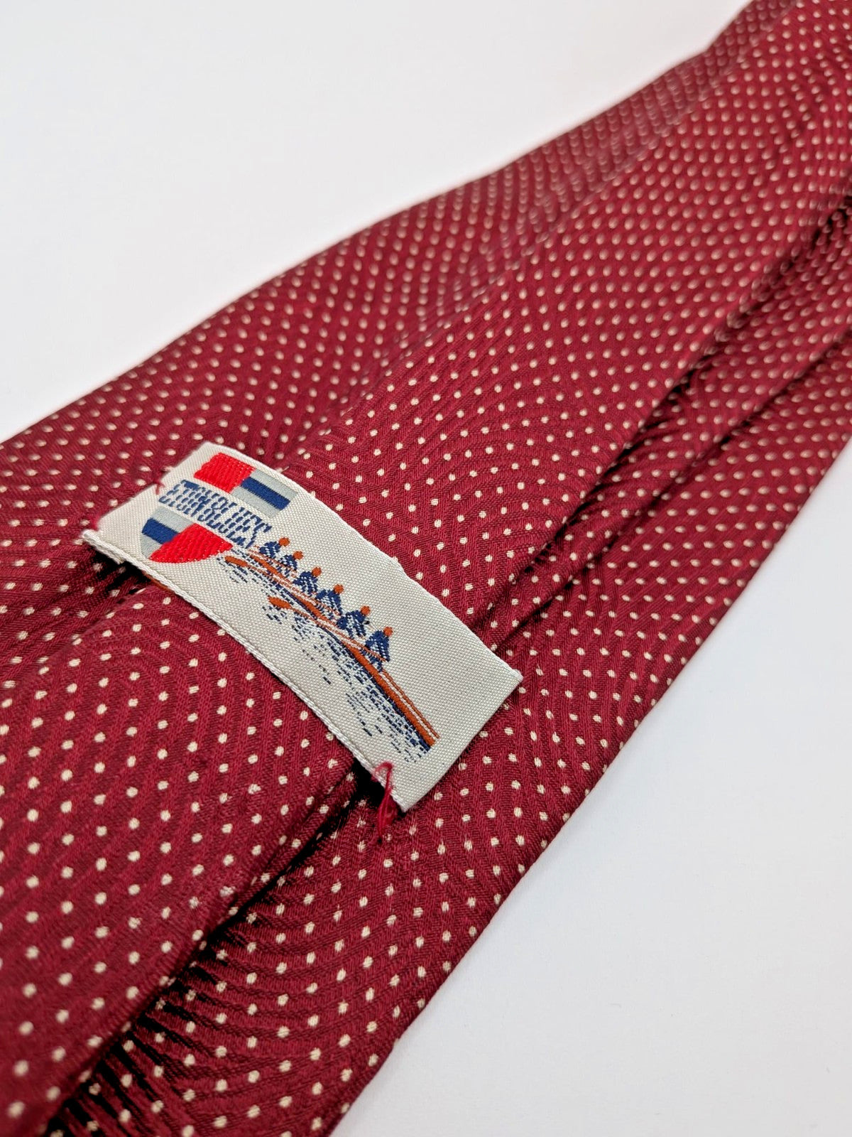 Bordeaux navy necktie 100% silk with cream polka dot pattern and original label.
