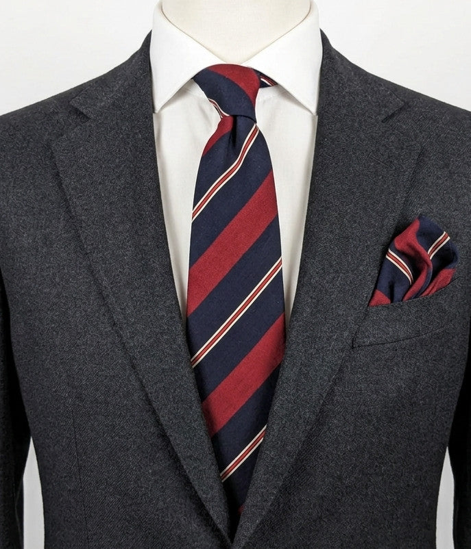 Blazer necktie navy with regimental diagonal stripes in blue, burgundy, white, and red.
